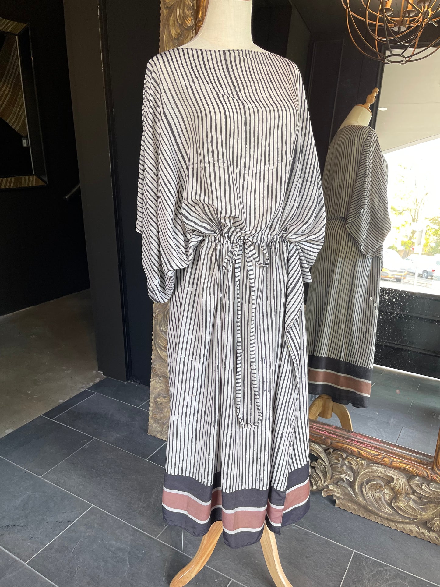 Designed by esteemed Indonesian designer Warwick Purser, this beautiful Kaftan showcases a special pattern printed by hand using the traditional Batik printing methods of East Indonesian villages & complete with a drawstring is perfect for cinching at the waist. Crafted from breathable bamboo, providing lightweight comfort while making it perfect for warmer climates and travelling.