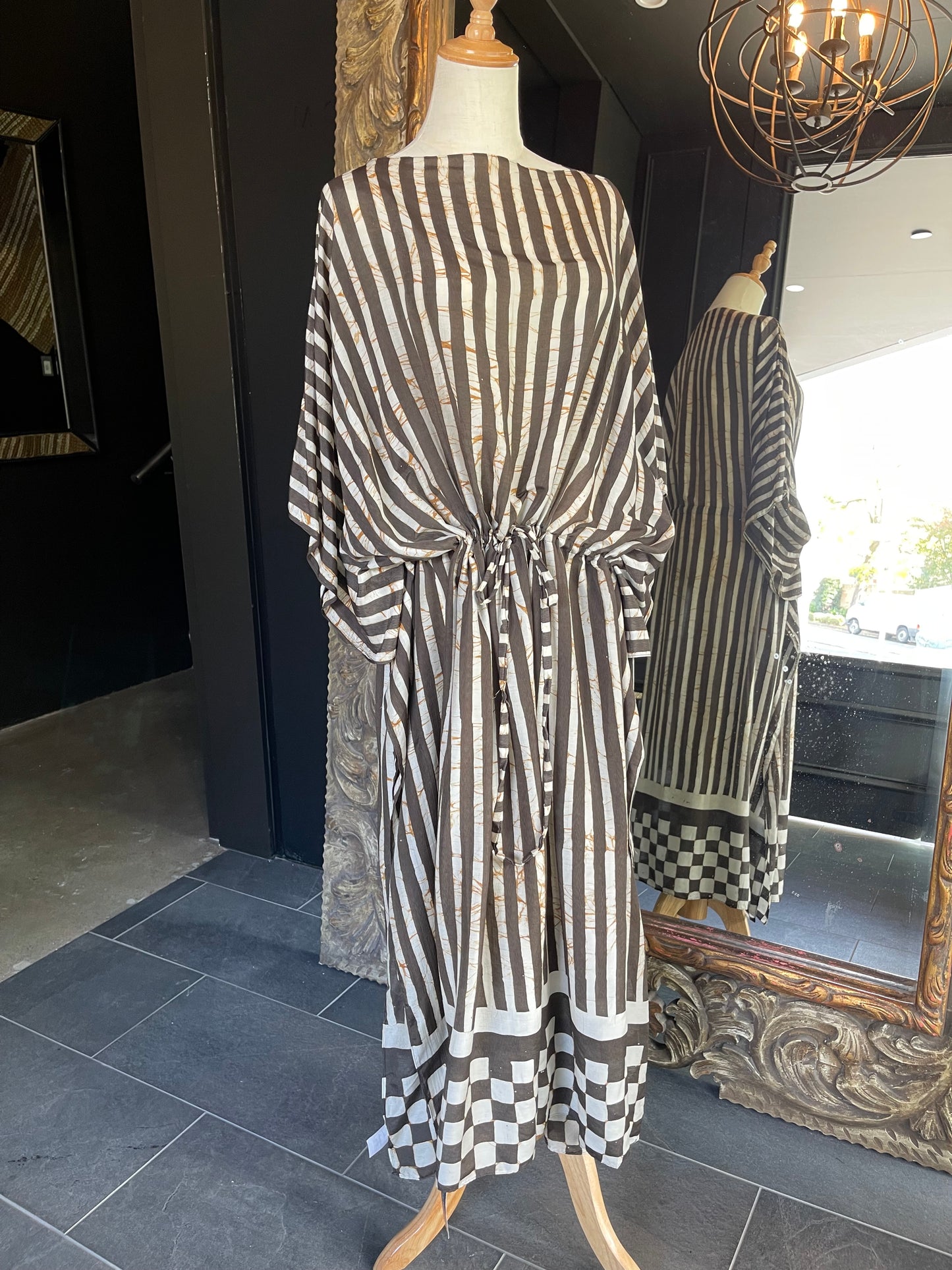 Designed by esteemed Indonesian designer Warwick Purser, this beautiful Kaftan showcases a special pattern printed by hand using the traditional Batik printing methods of East Indonesian villages & complete with a drawstring is perfect for cinching at the waist. Crafted from breathable bamboo, providing lightweight comfort while making it perfect for warmer climates and travelling.