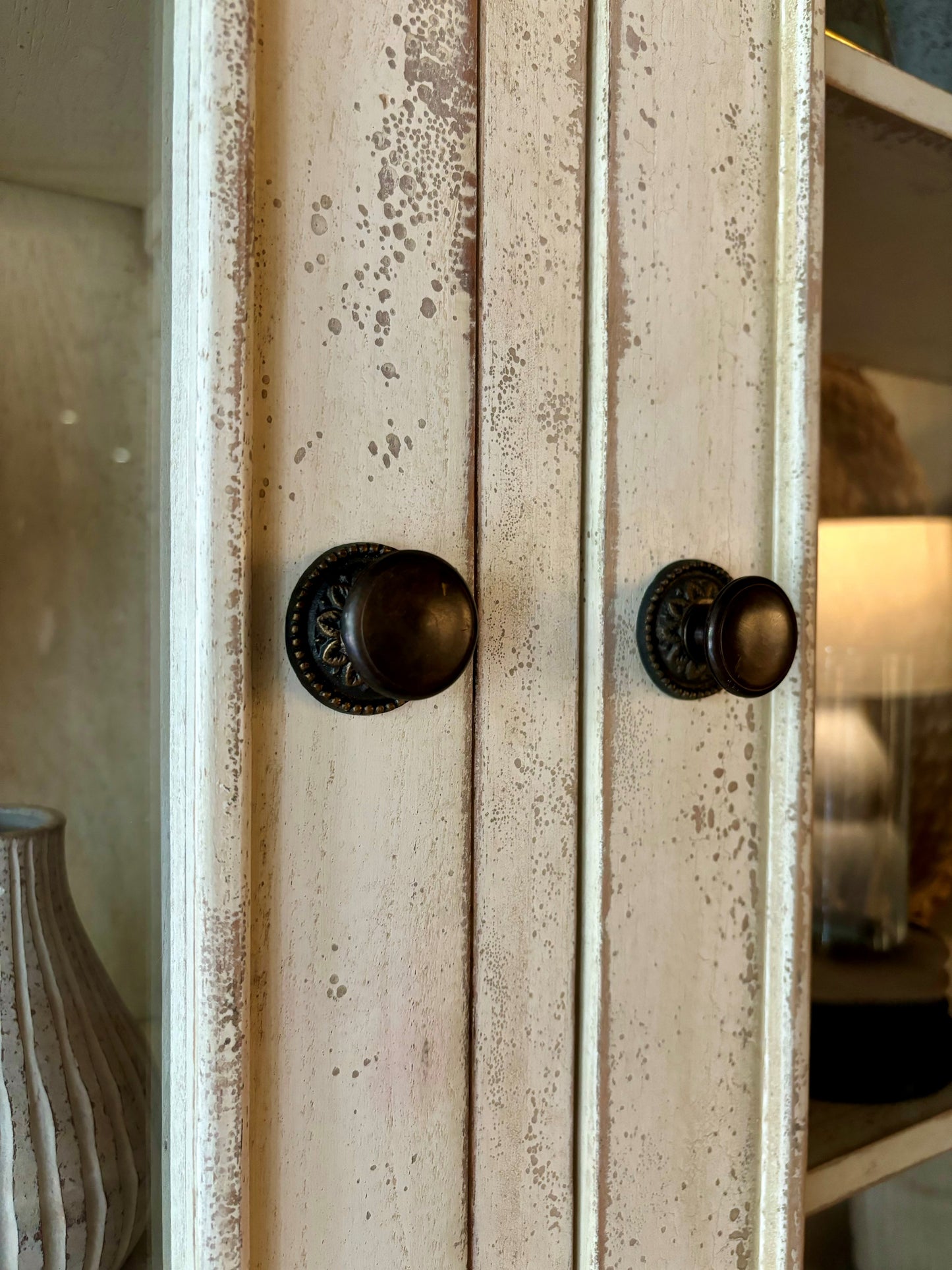 Grand and elegant in both scale and beauty, this exceptional tribute to a French Cabinet is hand made from solid mahogany and showcases an antiqued finish. Detail