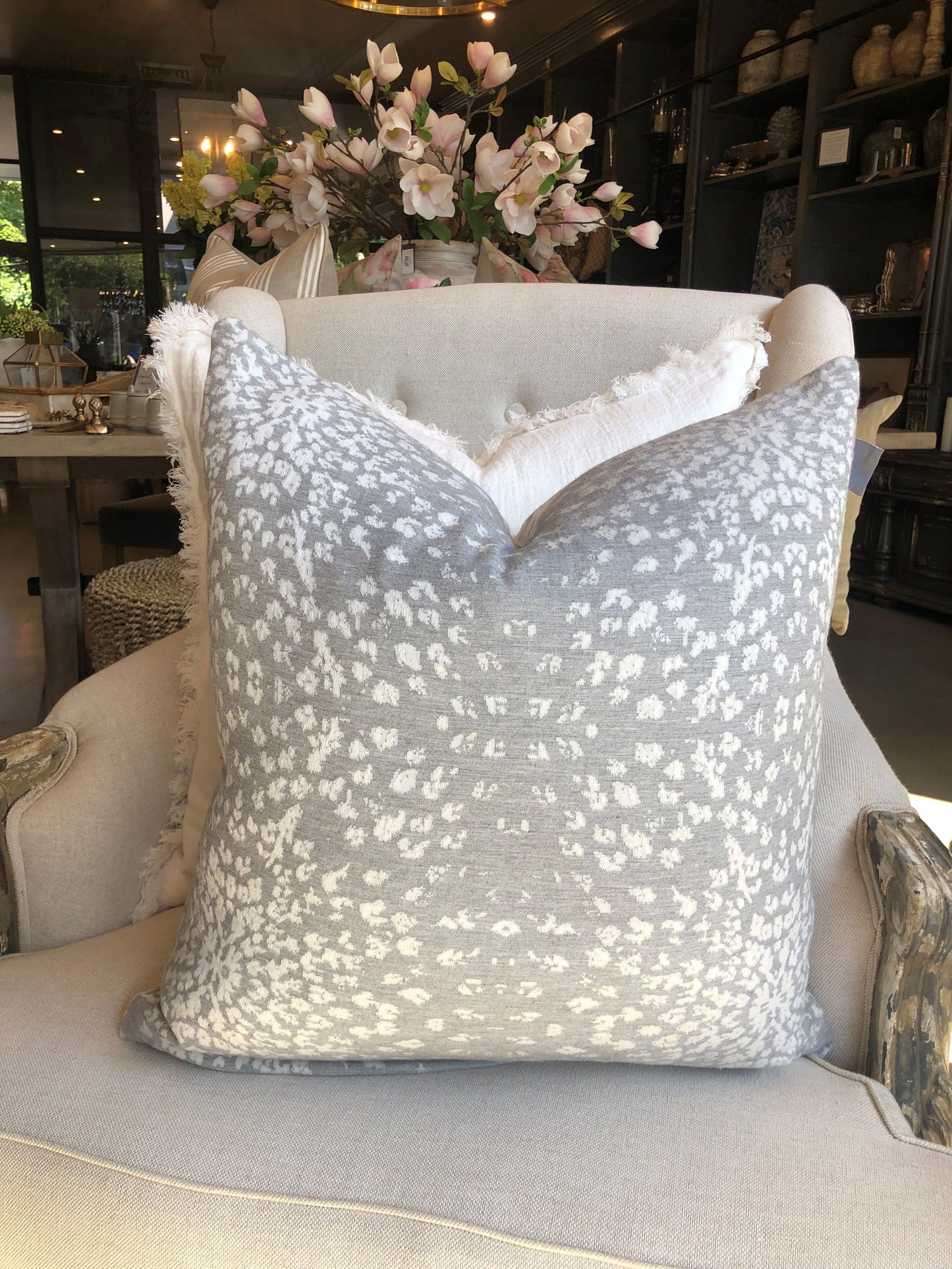 This Aspen Silver White Cotton & Cashmere Reversible Cushion is luxuriously soft, with exclusive plump feather insert for added comfort. Featuring a reversible design with snowflakes gracefully falling on both sides, choose from a crisp white or cool silver grey to accessorise your space. Reverse.