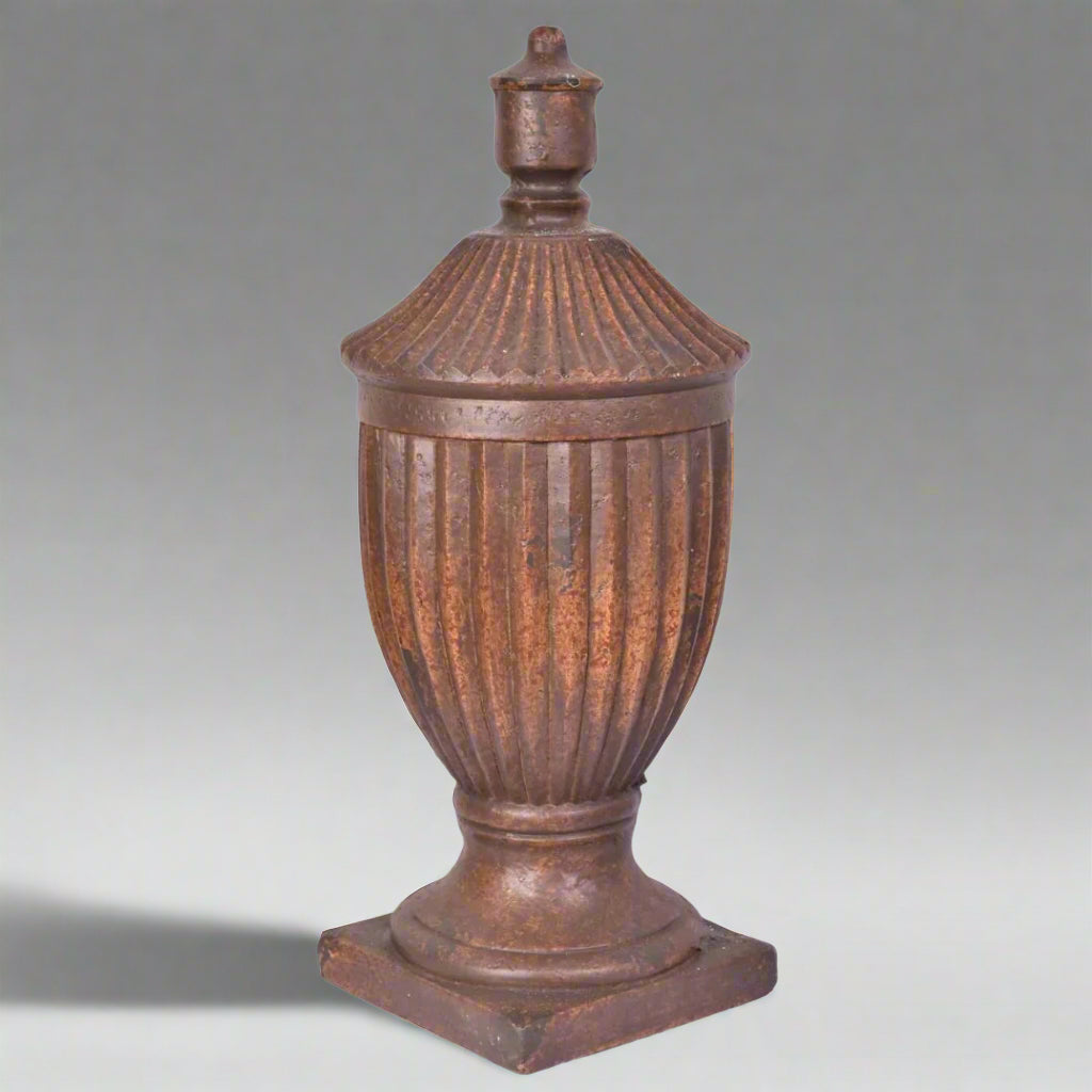 Decorative urn with a lid on a white background