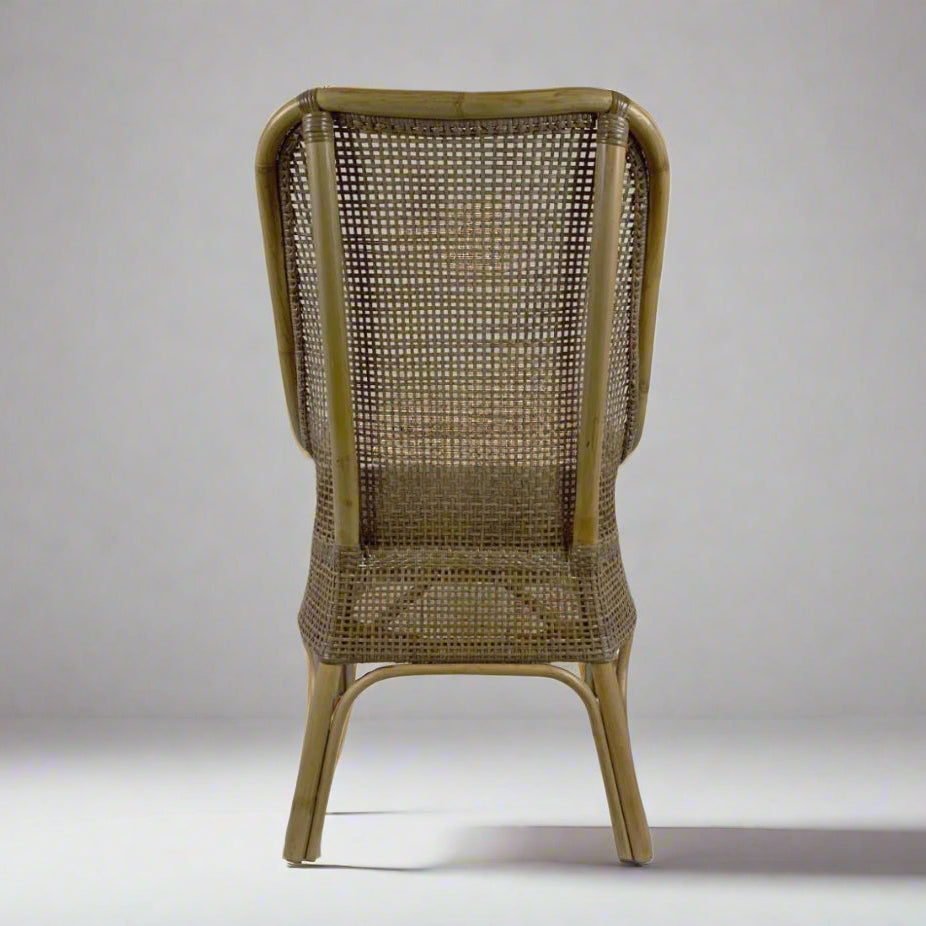 Wicker chair with a textured backrest on a plain background