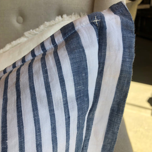 Experience the luxurious comfort and stylish design of the Joie De Vivre French Linen Blue White Stripe Cushion. Made with strong, hypo-allergenic yarn-dyed fabric, our cushions feature a vibrant color that won't fade. Each cushion is filled with a high-quality plush feather insert for maximum comfort. Elevate your home decor with our irresistible cushion.