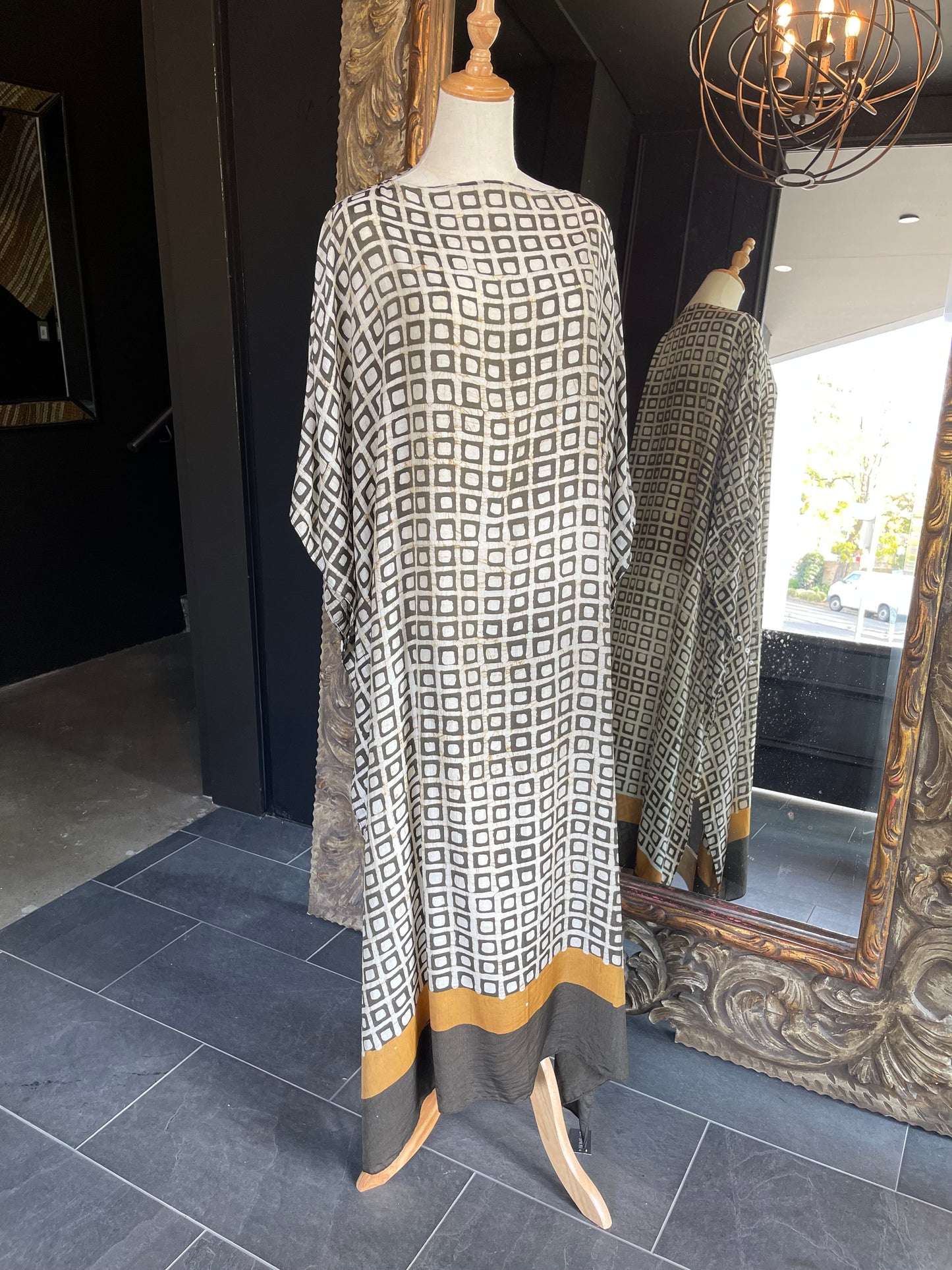 Designed by esteemed Indonesian designer Warwick Purser, this beautiful Kaftan showcases a special pattern printed by hand using the traditional Batik printing methods of East Indonesian villages. Crafted from breathable bamboo, providing lightweight comfort while making it perfect for warmer climates and travelling.