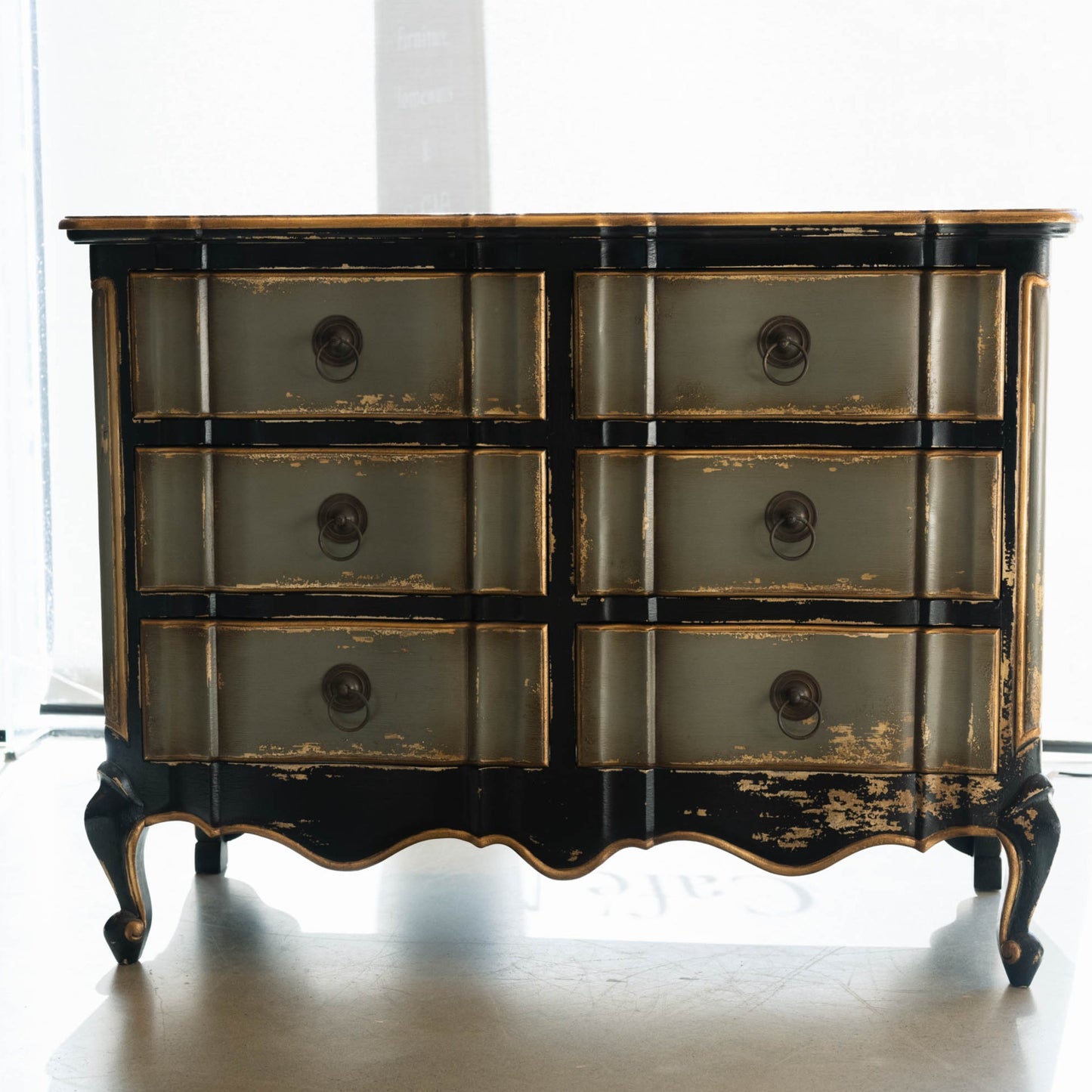 The Bellamy Commode is a unique furniture item, expertly crafted from mahogany and boasting a meticulously hand-painted finish. This elegant piece is sure to become a treasured heirloom in any home. Front
