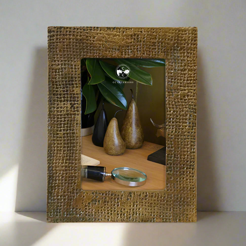 Capture your most cherished memories in style with the Winston Antique Brass Finish Photo Frame. This exquisite frame boasts a timeless sophistication and can be displayed in portrait or landscape orientation for ultimate versatility. Made from high-quality aluminium, this frame features a stunning dimpled antique brass finish that adds a touch of elegance to any room.