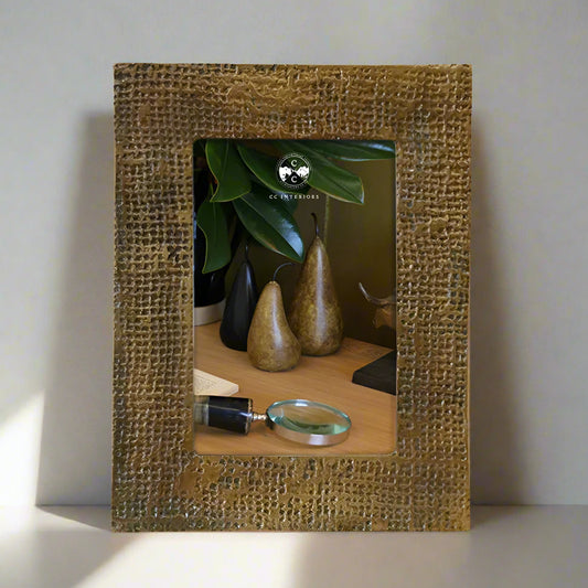 Capture your most cherished memories in style with the Winston Antique Brass Finish Photo Frame. This exquisite frame boasts a timeless sophistication and can be displayed in portrait or landscape orientation for ultimate versatility. Made from high-quality aluminium, this frame features a stunning dimpled antique brass finish that adds a touch of elegance to any room.