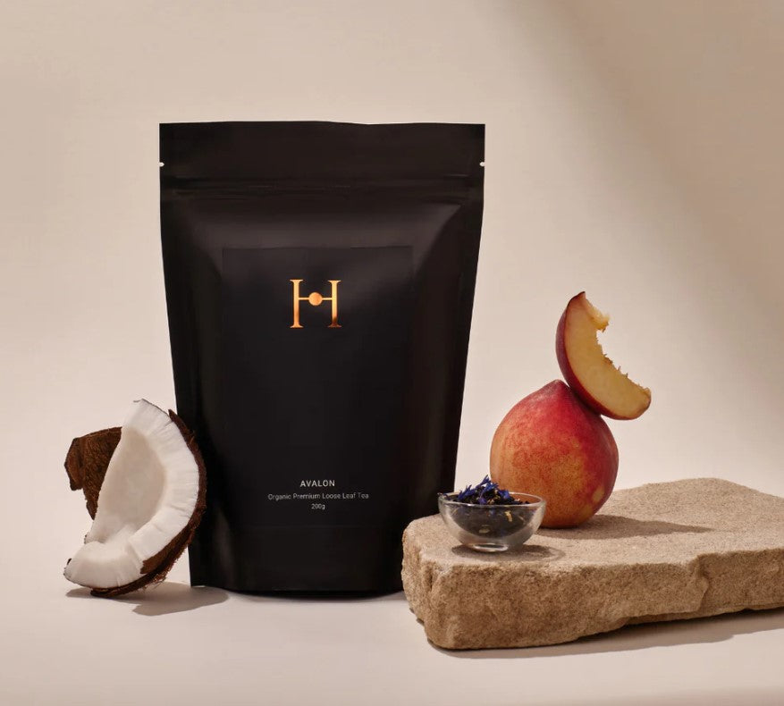 A delicious alluring black tea blend with a nuance of nutty coconut, top note of aromatic peach with slightly spicy and subtle floral overtones of blue cornflowers. Leaving a refreshing and uplifting taste on the palette to awaken your senses, reminiscent of the Australian coast line. Organic Hand blended in Australia Not tested on animals Vegan friendly 200g. Front