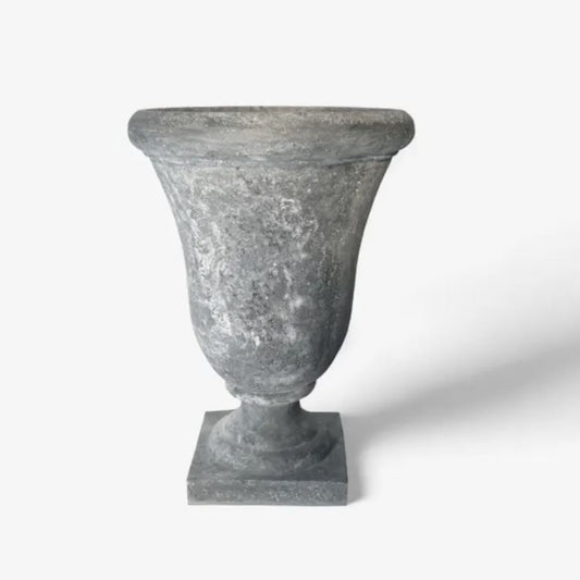 Grey stone urn on a white background