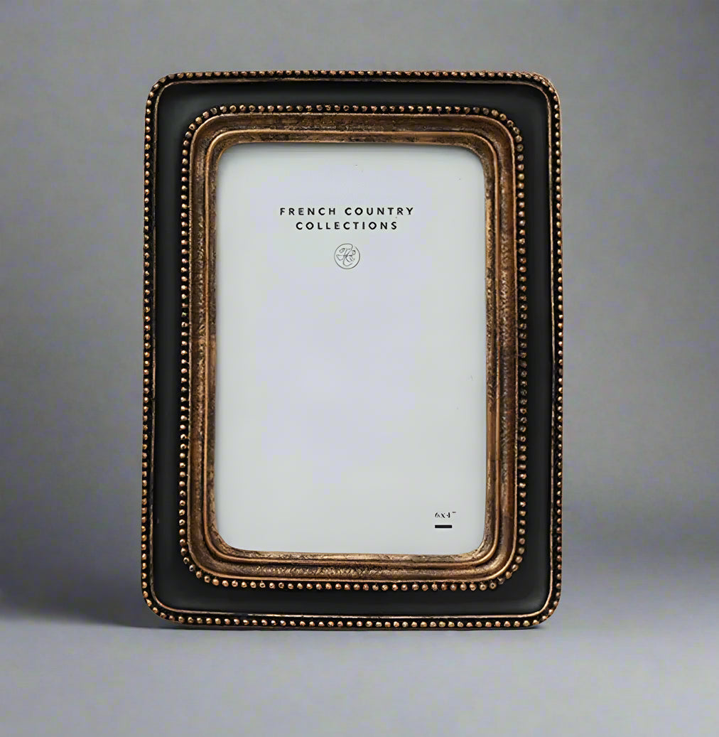 This elegant Beaded Black & Gold Photo Frame showcases a classic black and gold beaded pattern, bringing a sense of warmth and sophistication to any space. Its timeless design perfectly enhances your treasured photos or artwork, making every memory stand out beautifully.