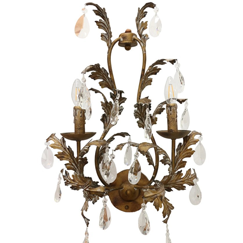A sophisticated wall sconce with a bronze finish, featuring leaf-like designs and hanging crystals.