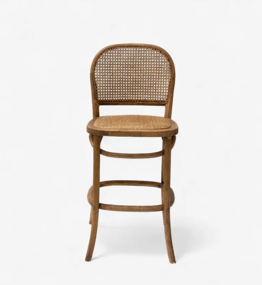 A classic bentwood bar stool with a natural woven cane seat and backrest, shown against a plain white background.