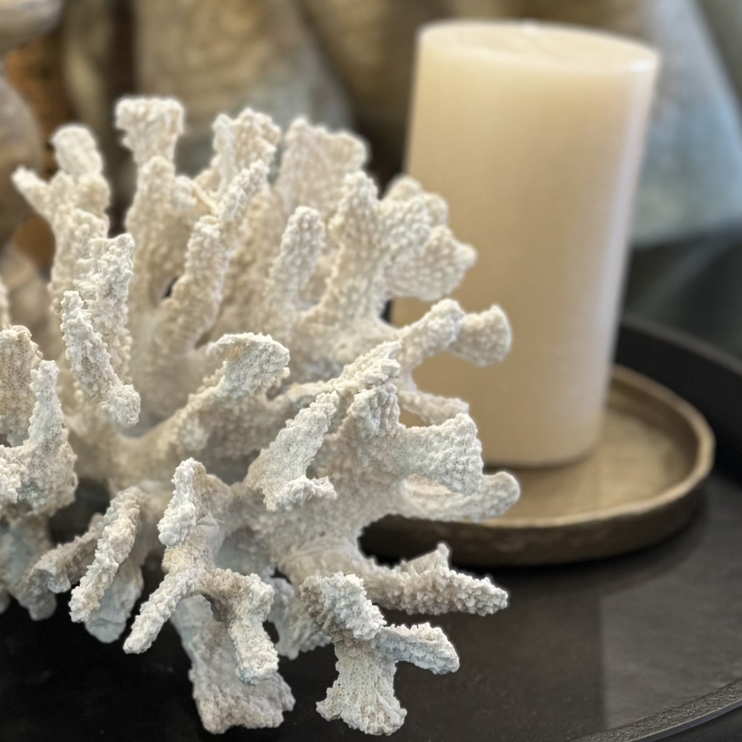 This White Reef Coral sculpture is the perfect way to bring a touch of the ocean into your home. Its intricate texture and complex design will give any setting an elegant, resort-like feel. Crafted from chemical-resistant polyresin, it's a durable piece that will keep its beauty for years. Add a chic, organic accent to your decor without harming the environment. Close up.