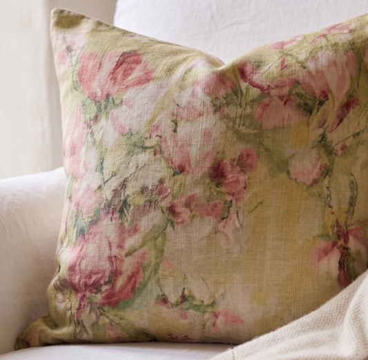 Floral patterned pillow on a white sofa