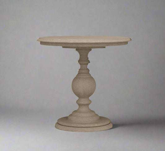 Round beige table with a textured pedestal base on a gray background
