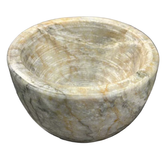Indulge in the captivating combination of off-white, brown, and grey hues found in our Sangiran Stone Bowl. Its exquisite, handcrafted design brings a touch of sophistication to any room. Ideal for showcasing on a coffee table, console, or bedside, it also doubles as a functional holder for precious trinkets, meticulously carved by skilled artisans in Southeast Asia.