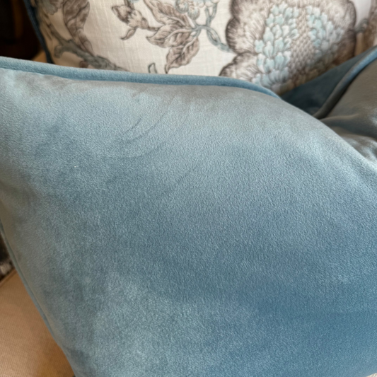 Indulge in the softness of our Blue Velvet Lumbar Cushion. This cushion adds style and luxury to any space, and comes with a concealed zipper for easy use. Filled with feather inserts for ultimate comfort and machine washable on a delicate cycle.