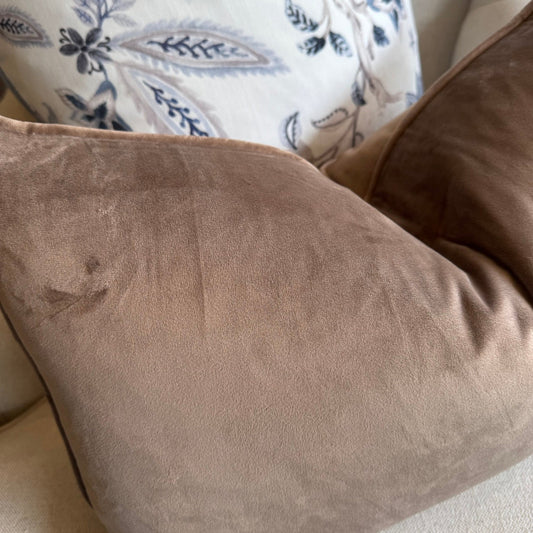 Experience the luxurious softness of our Mocha Velvet Lumbar Cushion. This cushion adds both style and indulgence to any room, featuring a hidden zipper for effortless use. Filled with feather inserts for ultimate comfort and easily machine washable on a delicate cycle. Perfectly suitable for any sofa or bed.