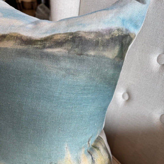 Indulge in the breath taking beauty of a tranquil beach landscape with the Island Summer Linen Cushion. Handcrafted by a local Auckland artist, the serene blues and soft hues capture the essence of New Zealand's rural settings. Perfect for any chair, this cushion is made from luxurious French organic linen and includes a feather filled insert for added comfort.