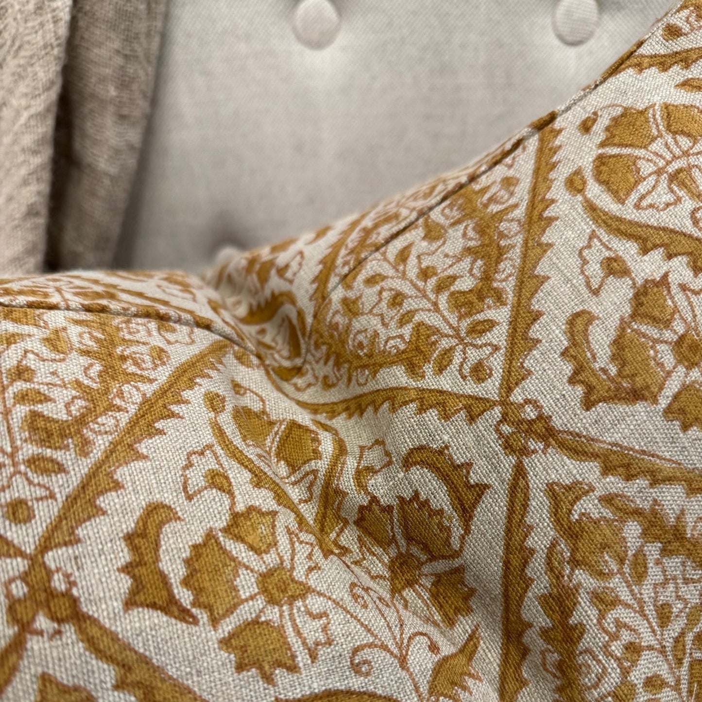 Experience the beauty of CHAMOIS' Jaipur Ochre Linen Cushion. Crafted with an Indian block print on 100% Belgian linen, it adds luxury and style to any home.