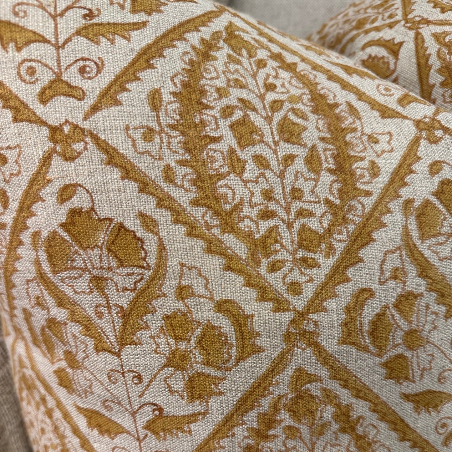 Experience the beauty of CHAMOIS' Jaipur Ochre Linen Cushion. Crafted with an Indian block print on 100% Belgian linen, it adds luxury and style to any home.