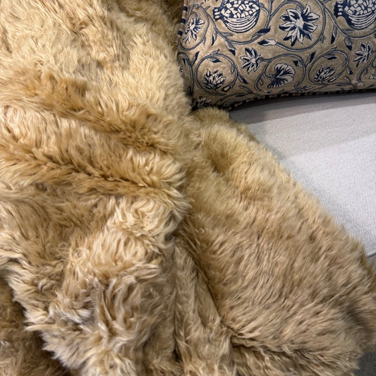 Transform any bedding or sofa into a cozy oasis with the Caramel & Ivory Soft Throw. Its opulent texture adds charm to any space, effortlessly complementing other fabrics. The neutral hue, easy to match with varying tones, creates an inviting ambiance that will make you feel right at home. Plus, it's machine washable on a cold cycle for your convenience.