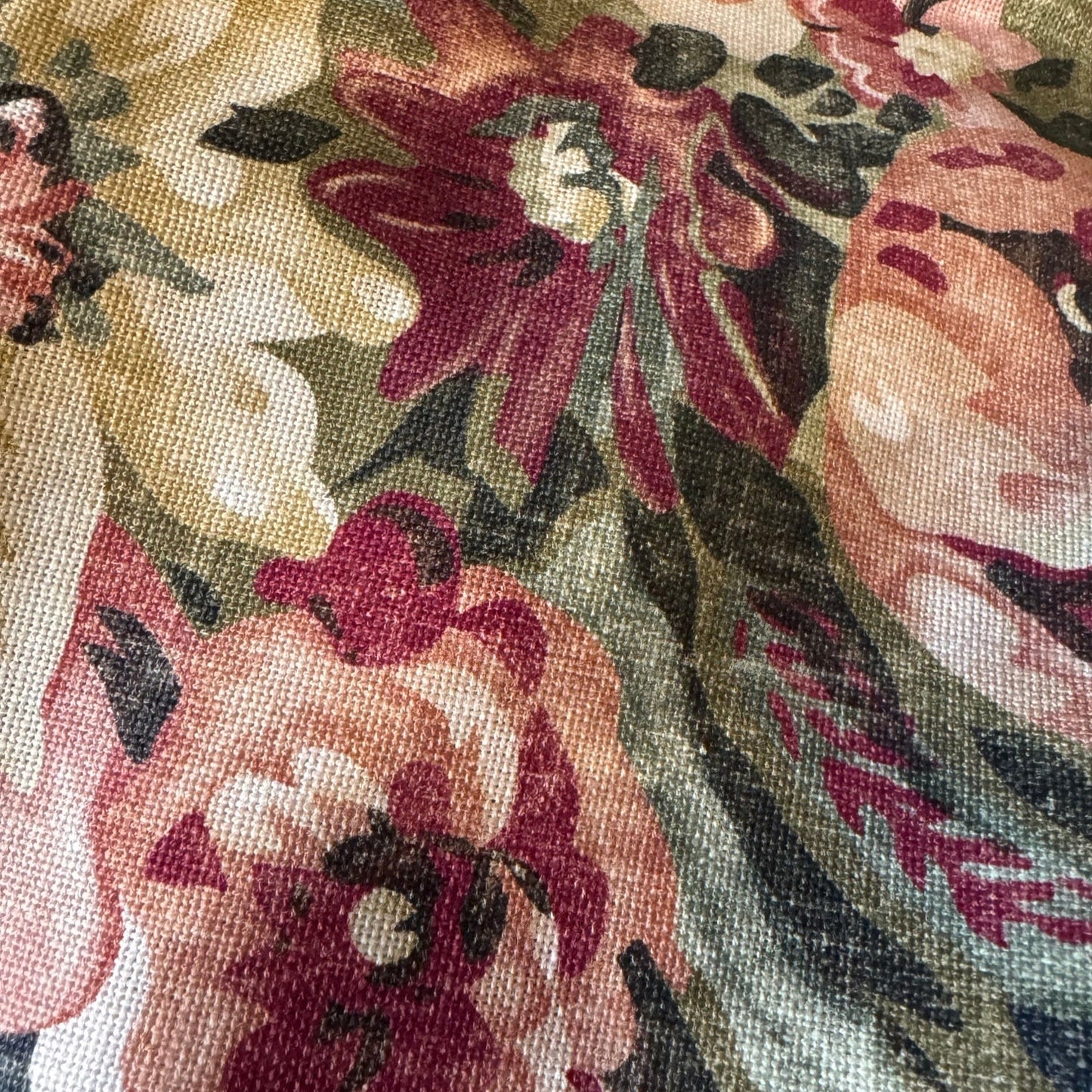 Elevate your home decor this season with the eye-catching Maree Floral Cushion. Be mesmerized by the beautiful floral patterns in rich pinks, greens, and burgundy against a deep background, making it the perfect centerpiece for any room. Its soft and cozy feather-filled insert offers both comfort and style.