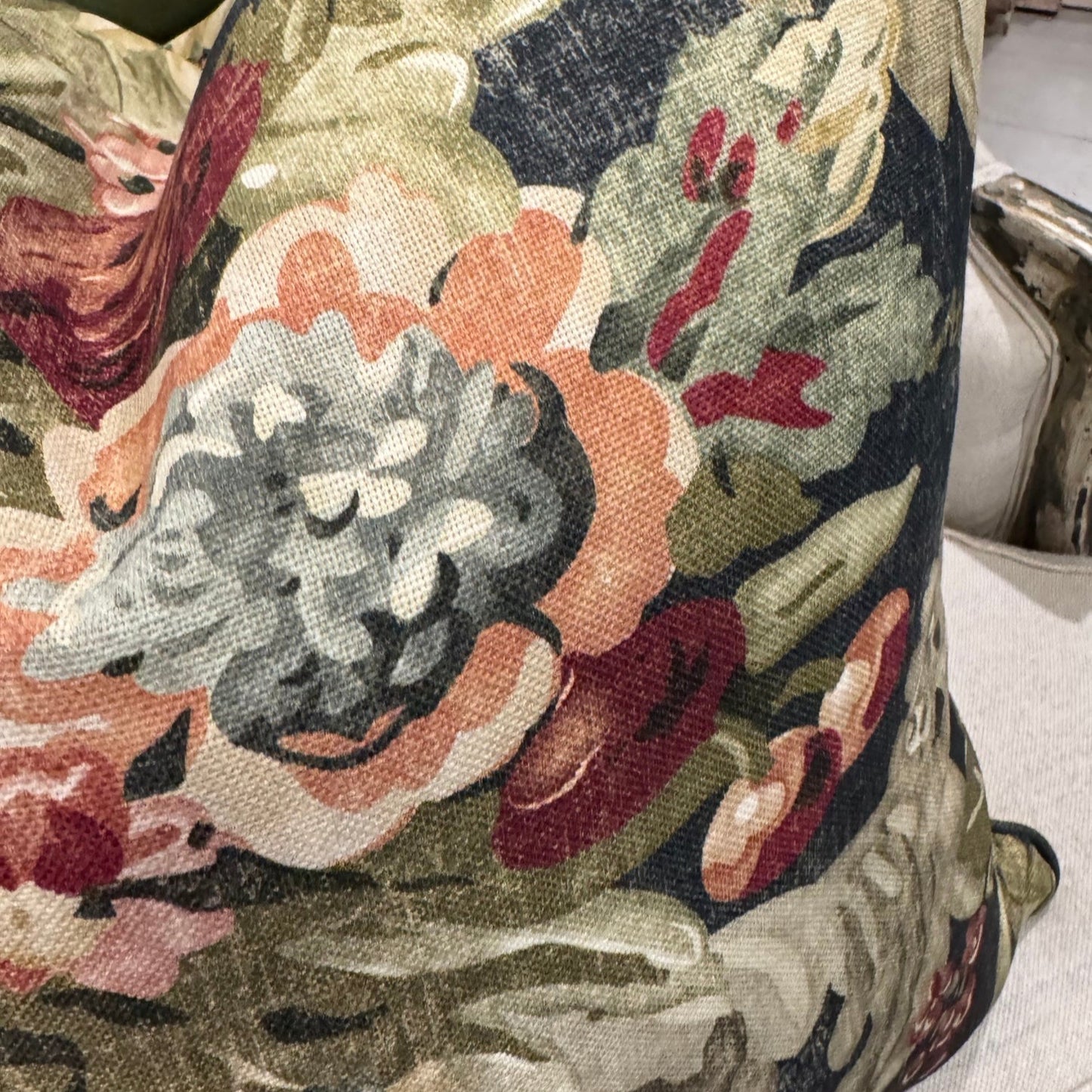Elevate your home decor this season with the eye-catching Maree Floral Cushion. Be mesmerized by the beautiful floral patterns in rich pinks, greens, and burgundy against a deep background, making it the perfect centerpiece for any room. Its soft and cozy feather-filled insert offers both comfort and style.