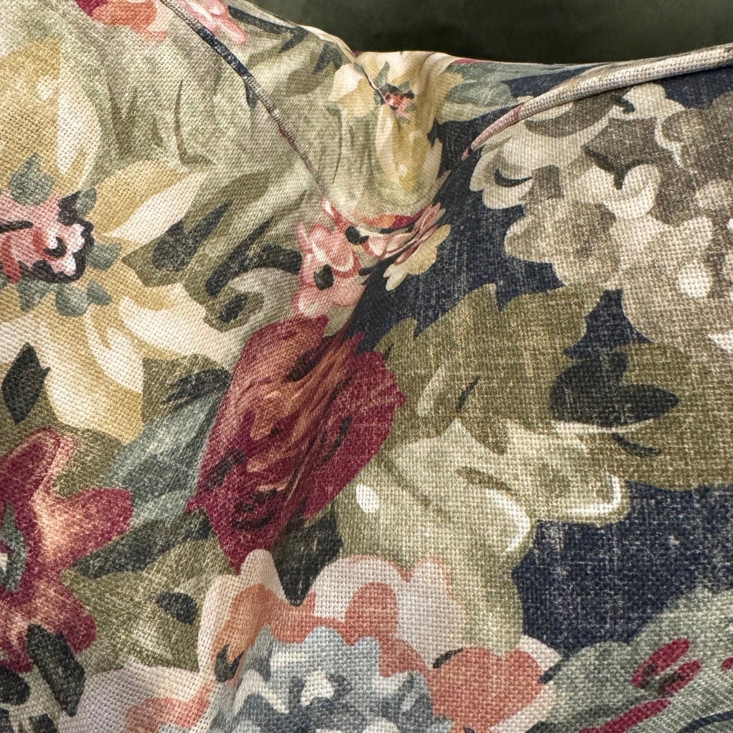 Elevate your home decor this season with the eye-catching Maree Floral Cushion. Be mesmerized by the beautiful floral patterns in rich pinks, greens, and burgundy against a deep background, making it the perfect centerpiece for any room. Its soft and cozy feather-filled insert offers both comfort and style.