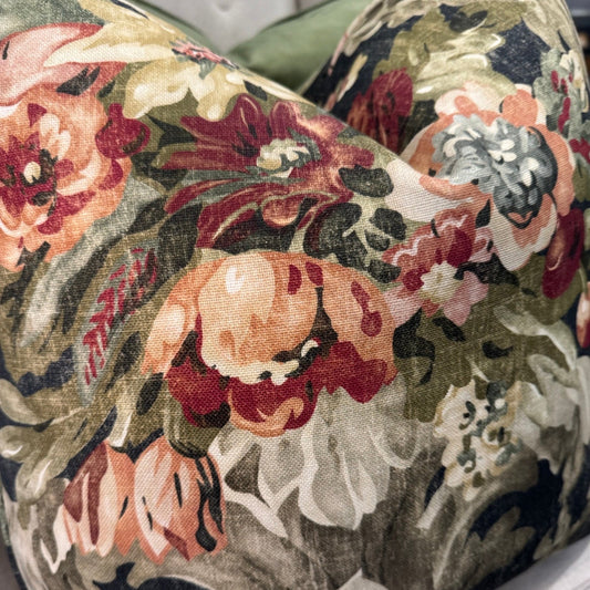 Elevate your home decor this season with the eye-catching Maree Floral Cushion. Be mesmerized by the beautiful floral patterns in rich pinks, greens, and burgundy against a deep background, making it the perfect centerpiece for any room. Its soft and cozy feather-filled insert offers both comfort and style.