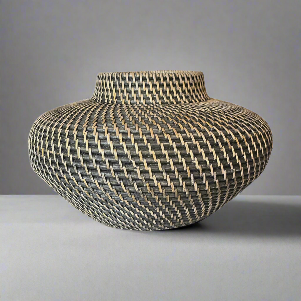 This stylish Handcrafted Mentari Black & Natural Rattan Bowl brings a classic, traditional feel to your home. Its intricate weave adds a beautiful decorative touch and is made to last. It is hand-made with high-quality rattan wood and is highly durable. Front.