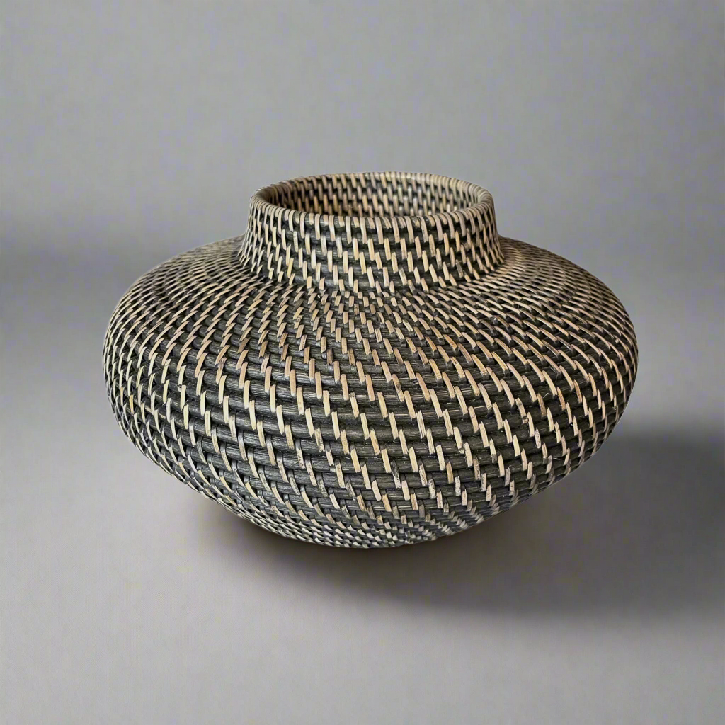 This stylish Handcrafted Mentari Black & Natural Rattan Bowl brings a classic, traditional feel to your home. Its intricate weave adds a beautiful decorative touch and is made to last. It is hand-made with high-quality rattan wood and is highly durable.