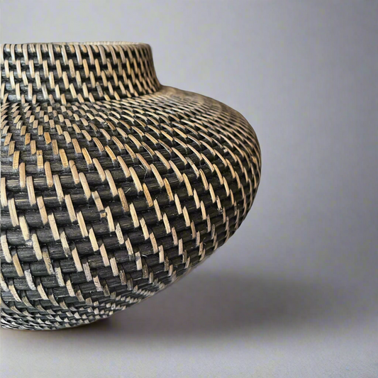 This stylish Handcrafted Mentari Black & Natural Rattan Bowl brings a classic, traditional feel to your home. Its intricate weave adds a beautiful decorative touch and is made to last. It is hand-made with high-quality rattan wood and is highly durable. Detail.