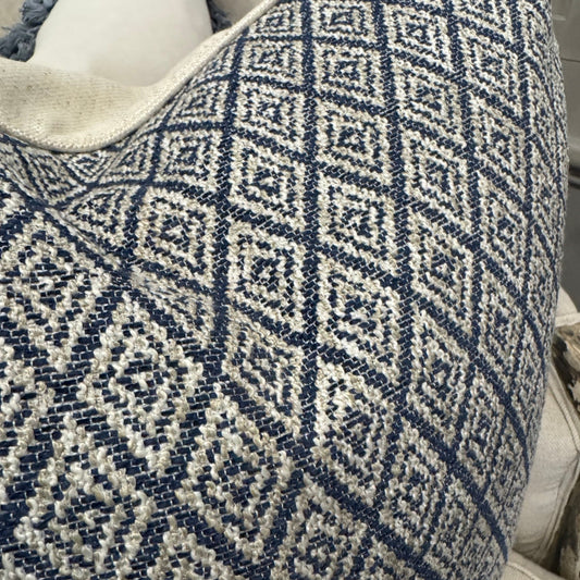 Elevate your home décor with the Hindi Sapphire Cushion crafted from exquisite Slender Morris fabric. Featuring a timeless diamond pattern in soft blue, cream, and taupe tones, it effortlessly complements any cushion arrangement, bringing a refined designer touch to your sofa, chair, or bedroom. Filled with luxurious feathers, it offers exceptional comfort, while the natural self-piping adds a polished, sophisticated finish. The plain natural back enhances its classic appeal, making it a perfect addition to