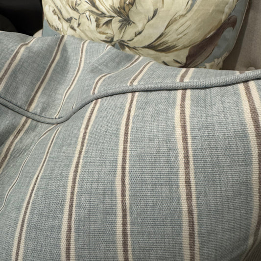 Elevate your home décor with the Slender Morris Duck Egg Blue Ticking Stripe Cushion, crafted from a premium cotton and linen blend. Its understated striped design effortlessly complements any cushion collection, bringing a refined designer touch to your sofa, chair, or bedroom. Filled with soft feathers, it offers exceptional comfort, while the plain duck egg self-piping adds a subtle, stylish finish.