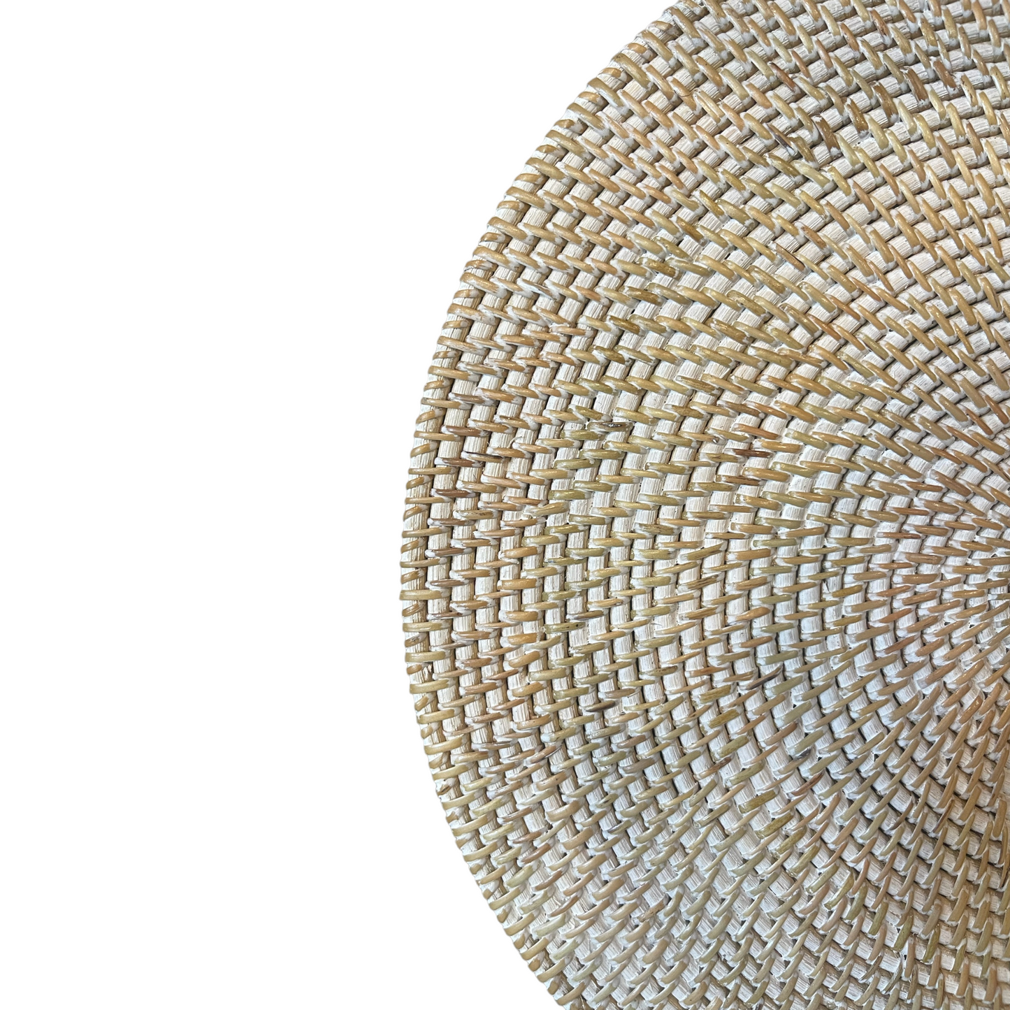 Indulge in a timeless tradition with our Handcrafted Melati White Washed Rattan Placemat. Artfully crafted in Indonesia, where basket-weaving dates back centuries, the placemat adds a rustic charm to any dining setting. Its white wash finish provides a polished touch, expertly protecting surfaces while complementing tableware. Close up.