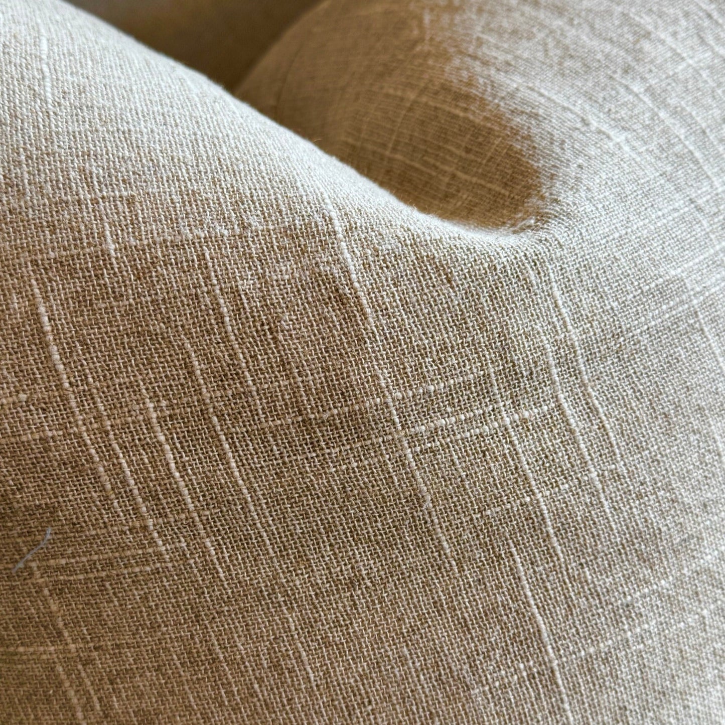 Close-up of beige fabric with a subtle pattern