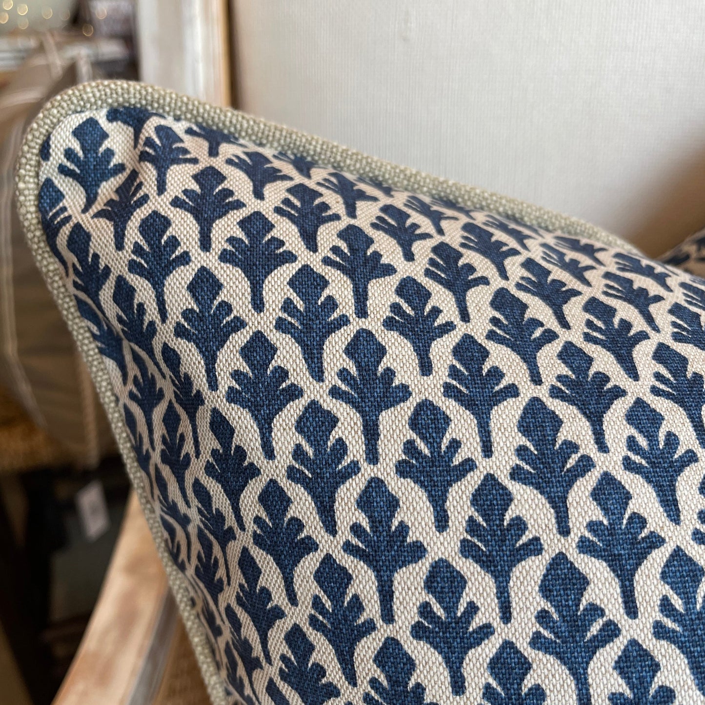 Experience the sublime craftsmanship of Lacefield Textiles with this lush Lacefield Ponce Marine Navy Patterned Cushion. Its heavyweight fabric is enjoyable to the touch and features an exquisite, traditional navy and taupe pattern on a natural background. Cuddle up and luxuriate with the indulgent feather insert! Corner close up.