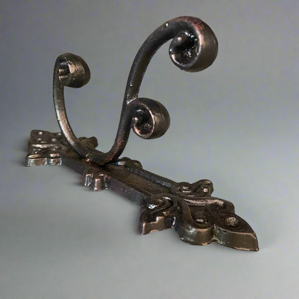 This charming & timeless cast iron hook is perfect in anywhere in the house for additional hanging.
