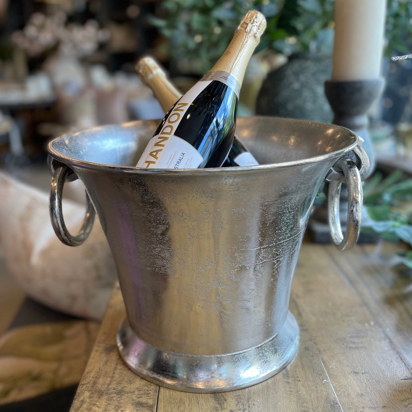 Indulge in the luxurious experience of using our Champagne Bucket with Ring Handles. Impress your guests and keep your drinks chilled with this elegant addition to your entertaining essentials. Elevate any special occasion with this stunning table feature. Styled.