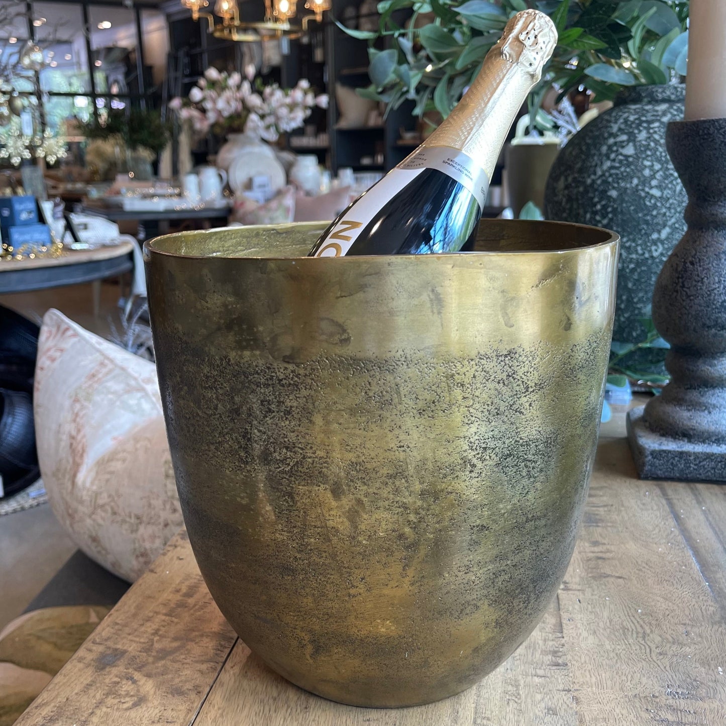 This sophisticated Versailles Gold Ice Bucket is ideal for hosting gatherings and keeping beverages chilled. It also functions well as a planter or vase, boasting an elegant aged gold hue. Styled.