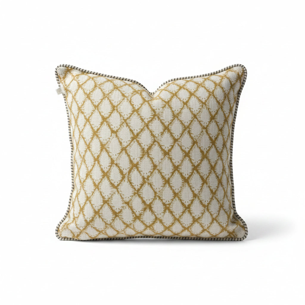 Elevate your home decor with the Cypress Block Printed Linen Ochre Cushion from CHAMOIS, a beloved Swedish brand known for their impeccable style. Crafted from premium Belgian 100% linen and featuring a soft feather insert, this cushion is a must-have for those who appreciate luxurious and high-quality design. Corner close up.