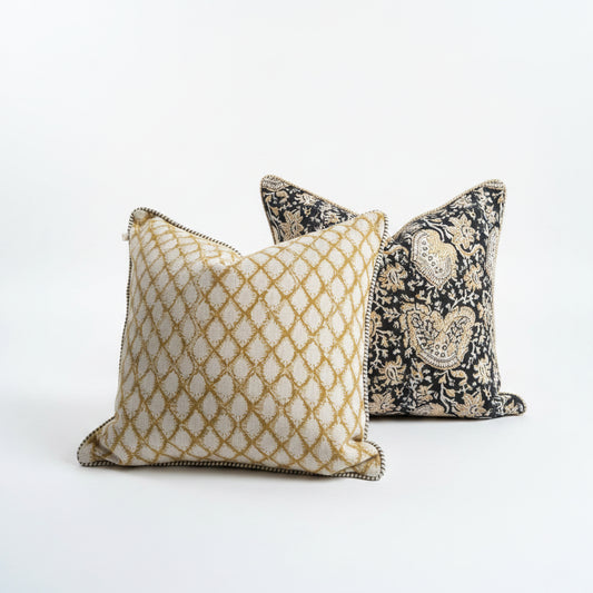 Elevate your home decor with the Cypress Block Printed Linen Ochre Cushion from CHAMOIS, a beloved Swedish brand known for their impeccable style. Crafted from premium Belgian 100% linen and featuring a soft feather insert, this cushion is a must-have for those who appreciate luxurious and high-quality design. Close up detail.