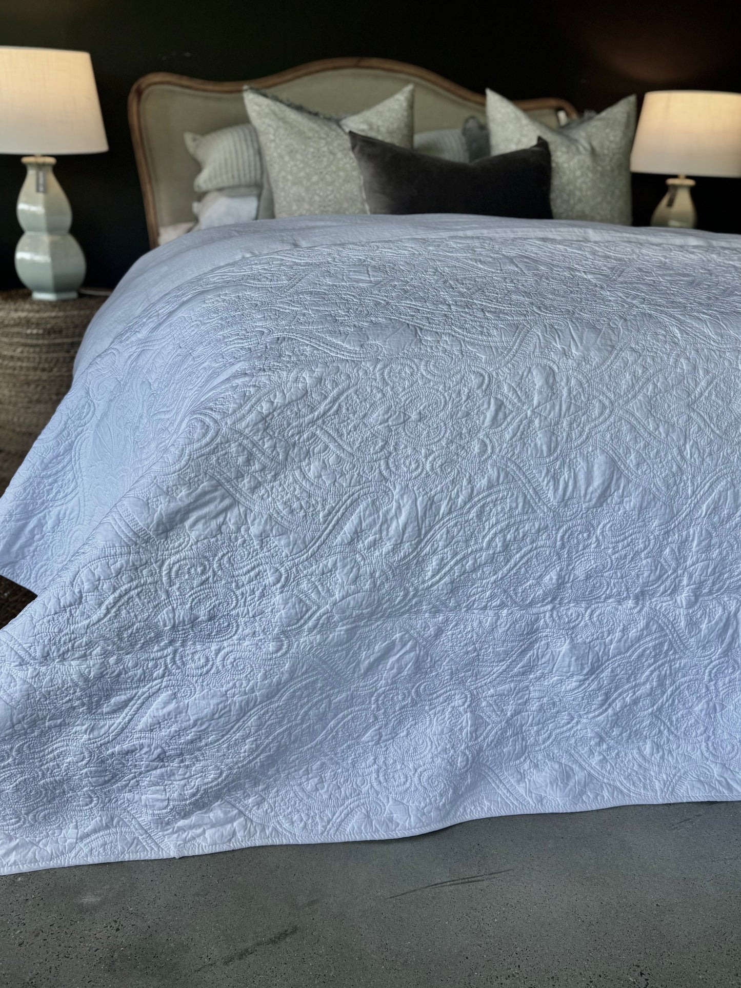 This Provence Damask 100% cotton quilt exudes both comfort and style. Featuring a charming and timeless pattern with intricate cross stitching, it's sure to add a touch of elegance to your bedroom. Crafted with soft and luxurious 100% cotton fabric and wadding, it's also conveniently machine washable on a delicate cycle. Distant.