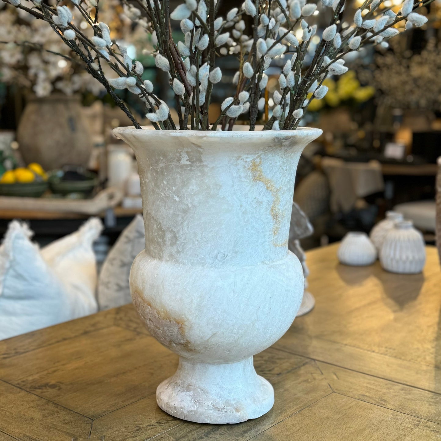 Experience the exquisite craftsmanship of our Chiskha Onyx Vase, hand-carved by skilled artisans in South East Asia. This stunning piece is made from a single block of quarried onyx, showcasing its natural beauty and unique colour veins. Make a statement with this gallery-quality vase, whether you display it as is or add your own touch with vibrant florals.
