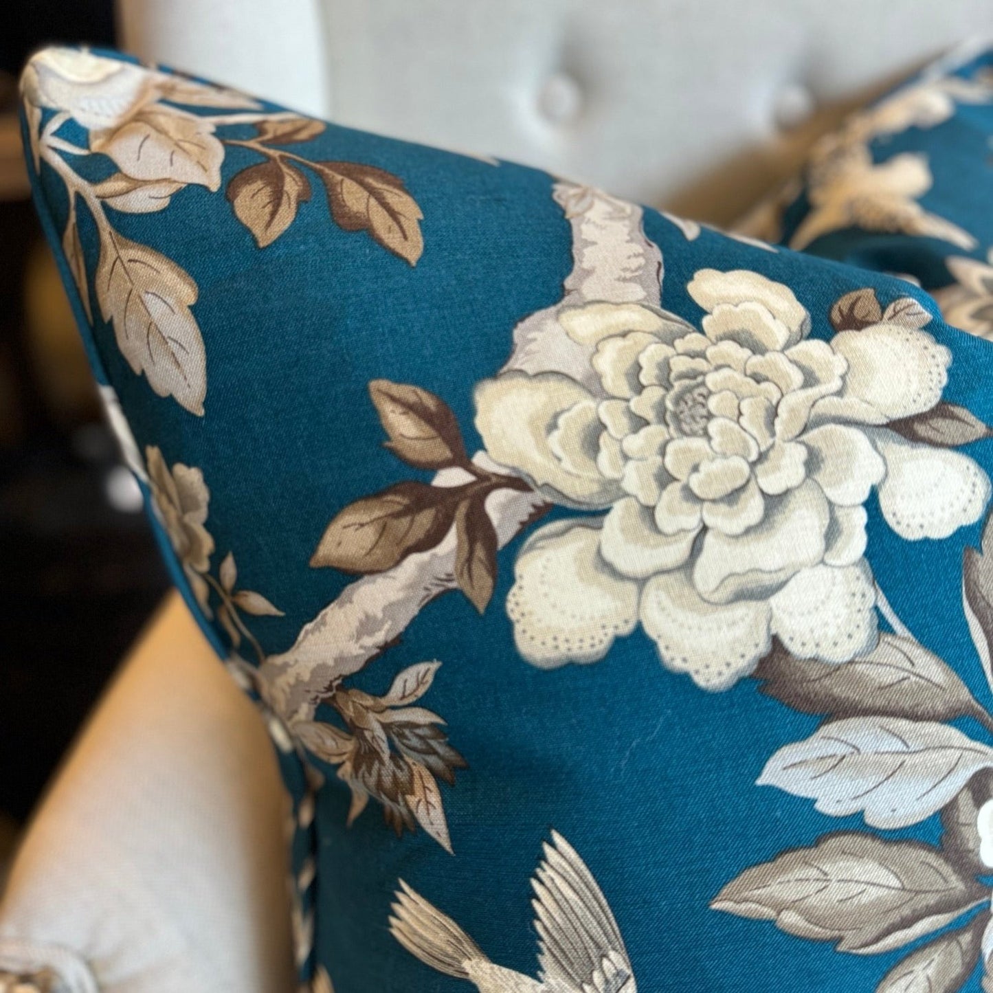 Transform your living space with the breath taking Ophelia Bird & Floral Spray Cushion, adorned with beautiful flying birds and blooming branches on a luxurious teal backdrop. Crafted from soft cotton fabric, this cushion comes with a feather insert for ultimate comfort.