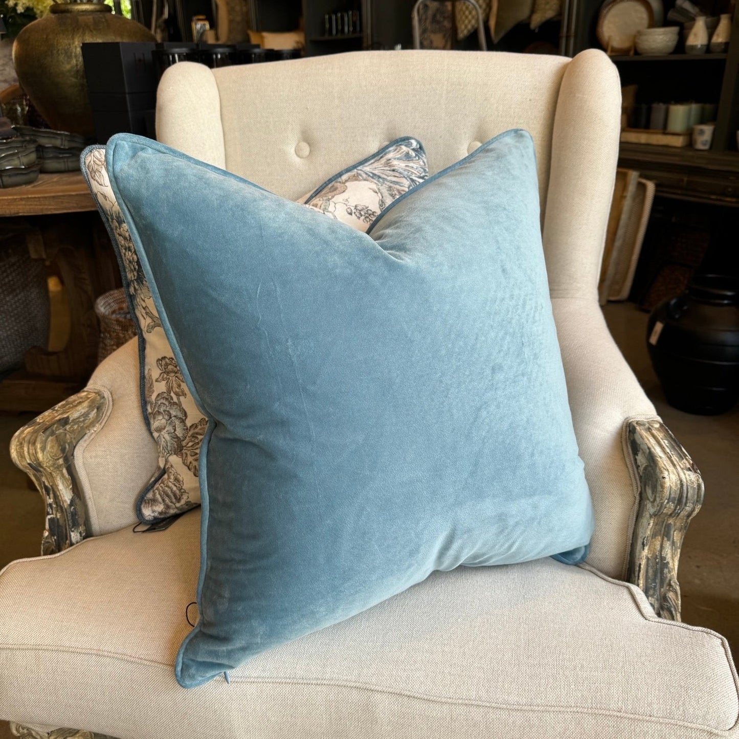 Experience the luxurious softness of our Blue Velvet Cushion. Elevate any space with style and opulence, featuring a hidden zipper for easy use. Filled with feather inserts for ultimate comfort and conveniently machine washable on a delicate cycle. Its stunning colour is perfect for layering with other cushions on a sofa or in the bedroom.