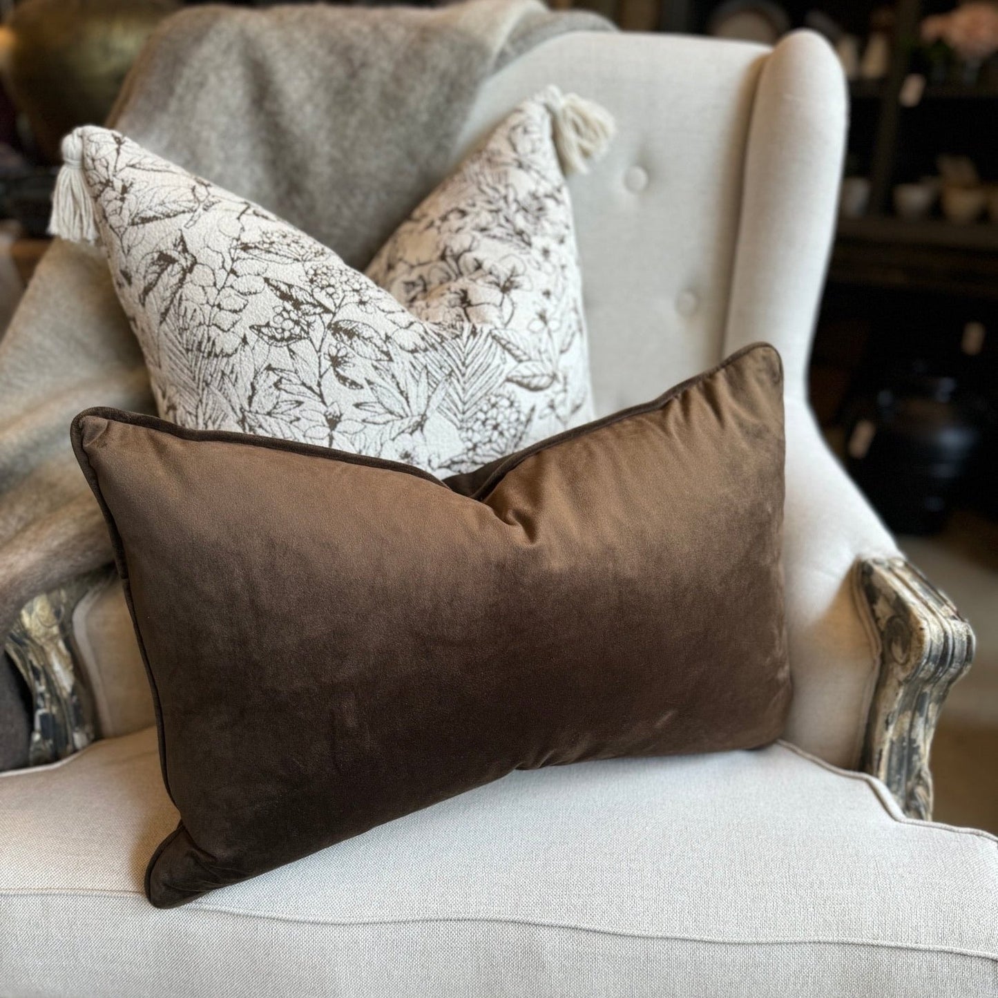 Indulge in the opulent comfort of the Coco Velvet Lumbar Cushion. This superb cushion enhances any room with its sophisticated design and features a discreet zipper for easy handling. Filled with feather inserts for unparalleled coziness and conveniently machine washable on a delicate cycle. The warm honeycomb colour exudes an air of refinement and complements a range of hues. The sumptuous velvet fabric is accented with thick matching piping on all sides.