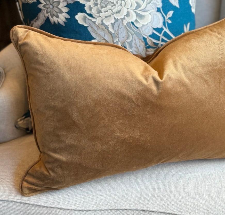 Indulge in the opulent comfort of the Honeycomb Velvet Lumbar Cushion. This superb cushion enhances any room with its sophisticated design and features a discreet zipper for easy handling. Filled with feather inserts for unparalleled coziness and conveniently machine washable on a delicate cycle. The warm honeycomb colour exudes an air of refinement and complements a range of hues. The sumptuous velvet fabric is accented with thick matching piping on all sides.