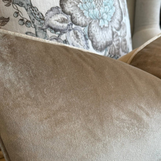 Indulge in the opulent comfort of the Champagne Velvet Lumbar Cushion. This superb cushion enhances any room with its sophisticated design and features a discreet zipper for easy handling. Filled with feather inserts for unparalleled coziness and conveniently machine washable on a delicate cycle. The stunning champagne colour exudes an air of refinement and complements a range of hues